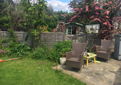 An ugly patio and old, broken fencing