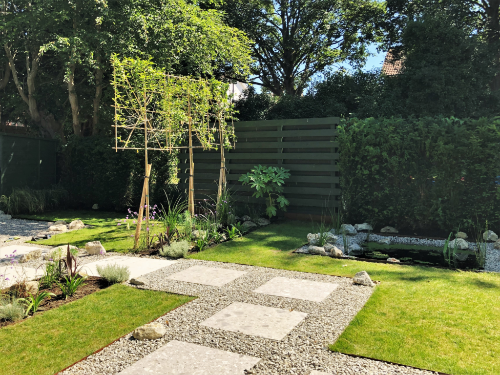 Rebuilt wildlife pond with hard liner in a Sevenoaks garden design